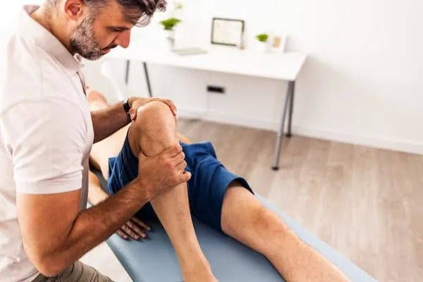 therapist helping a patient