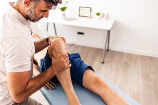 therapist helping a patient